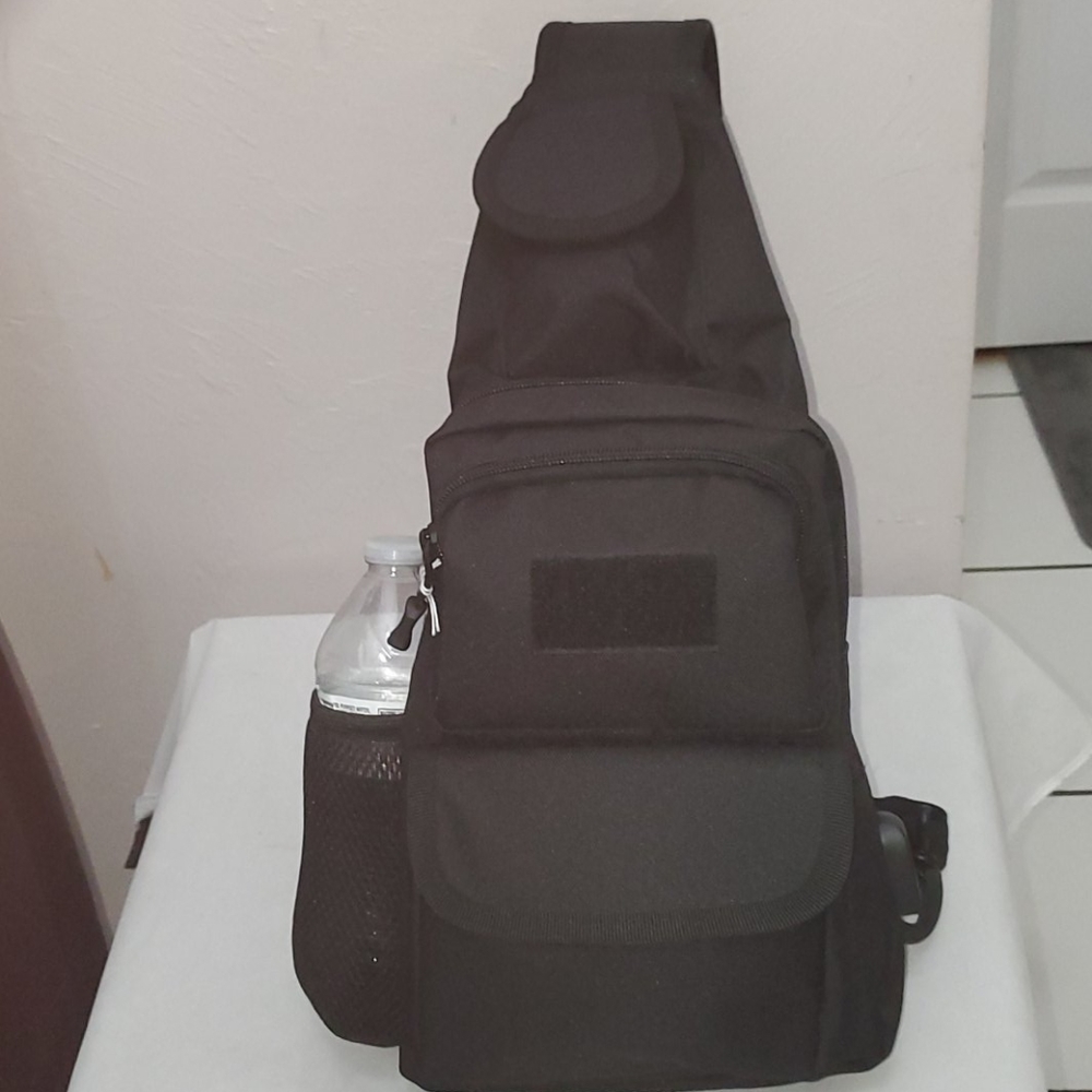 Black backpack one strap. Canvas lots room.